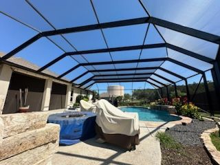 Custom pool enclosure with mesh panels surrounding outdoor pool in Leader TX Custom pool enclosure with mesh panels surrounding outdoor pool in Leader TX