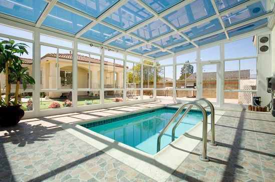 Screened enclosure over swimming pool with garden view in Cedar Park TX