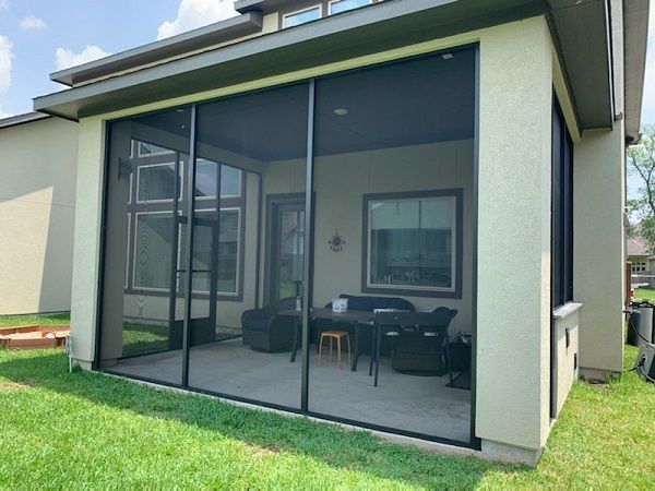 Patio Screen Enclosure in Austin TX featuring a patio cover and screen mesh walls.