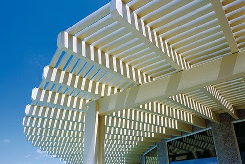 Modern aluminum pergola in Shertz backyard with solid roof shade