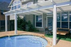 Aluminum pergola retreat in Terrell Hills backyard patio