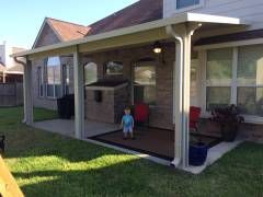 Patio cover with outdoor kitchen and grill in Pflugerville, TX