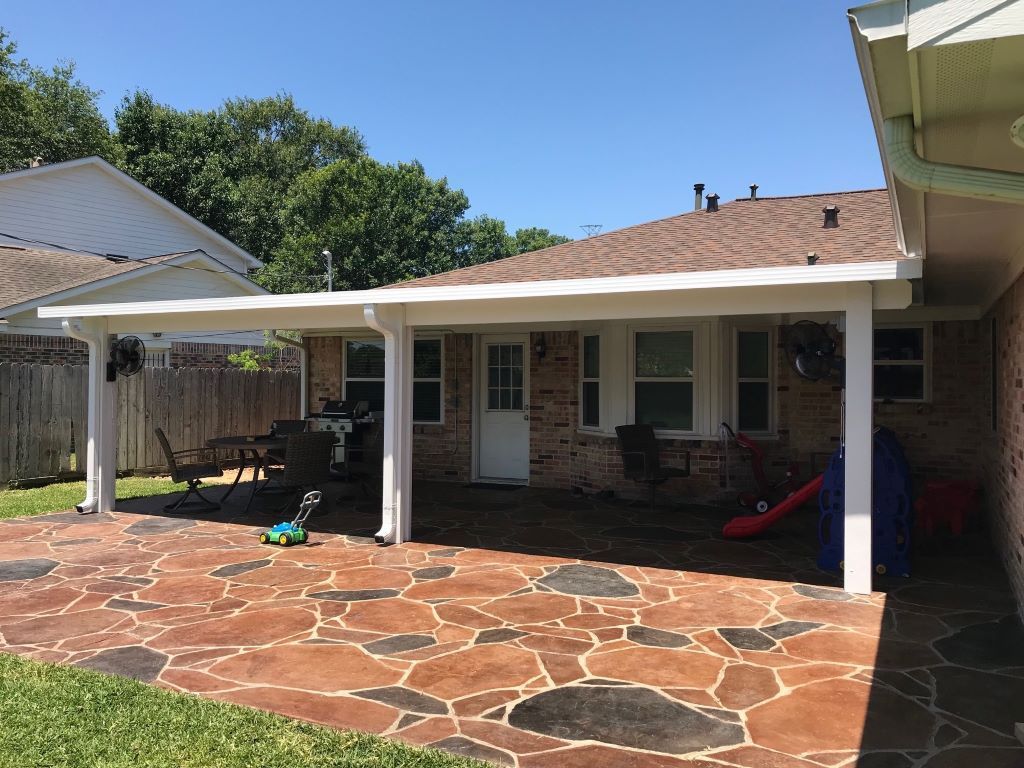 Custom patio cover with decorative wood beams in Austin, TX