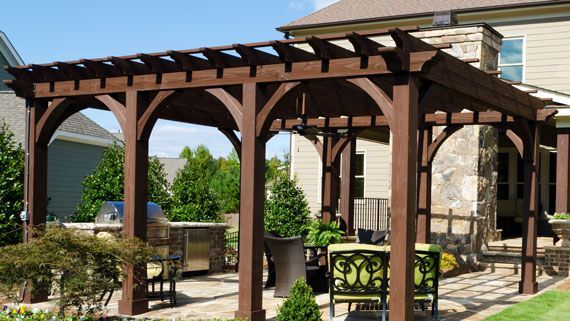 Heavy-duty timber pergola with decorative corbels and stone column bases in Timberwood Park. Heavy-duty timber pergola with decorative corbels and stone column bases in Timberwood Park.