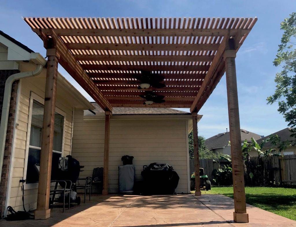 Pergola built to provide shade over a stone or paver patio
