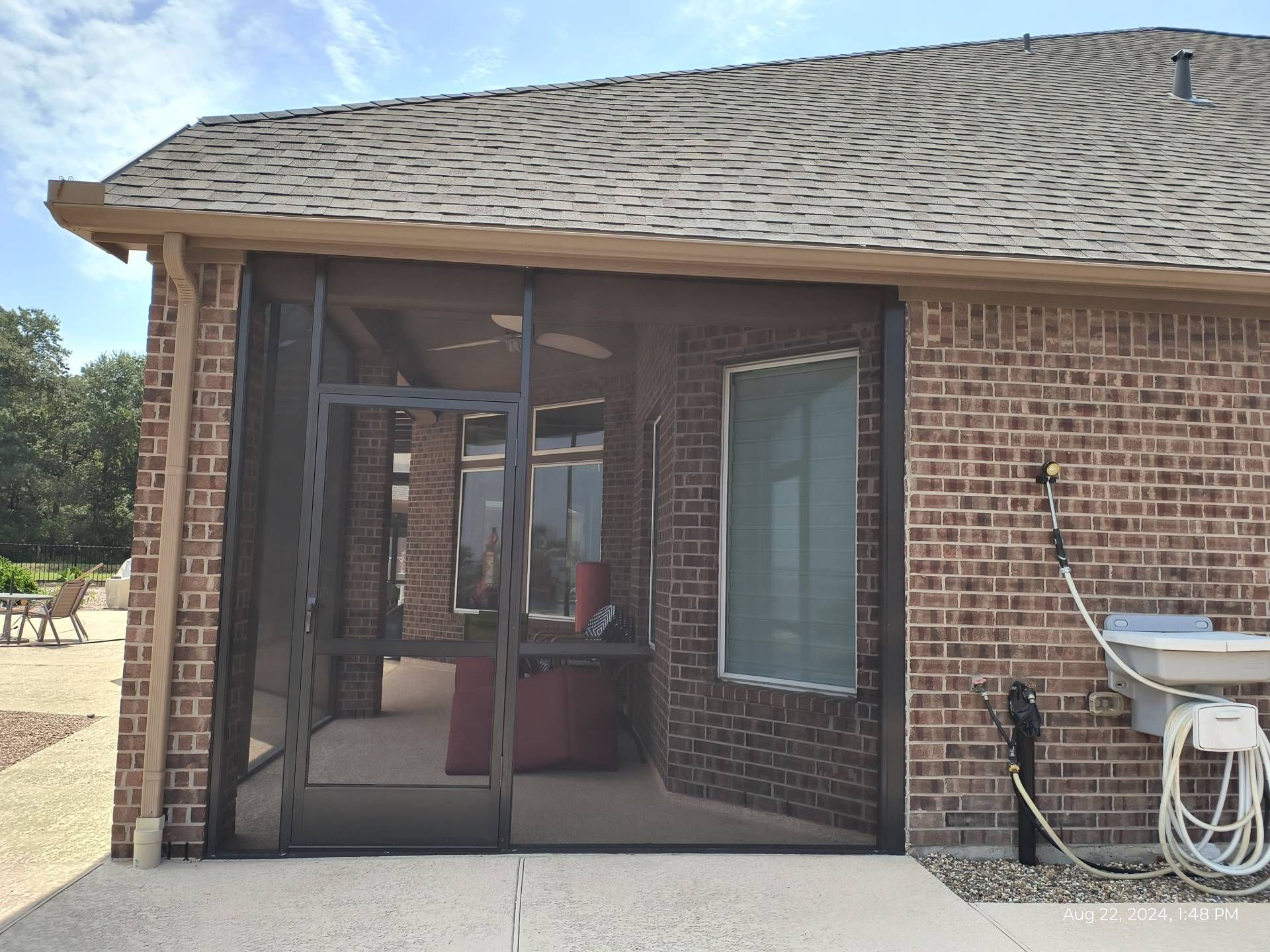 Screen room retreat with decorative beams in Von Ormy TX residence
