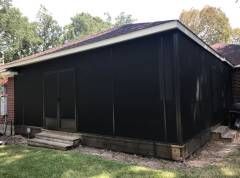 Screen enclosure retreat with cedar framing in Floresville backyard patio
