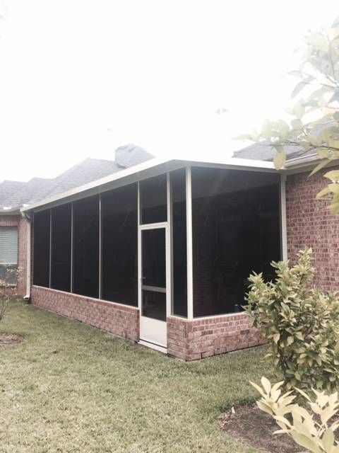 Homeowner relaxing in custom screen room in Dripping Springs, TX