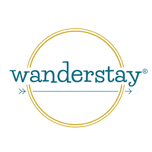 Wanderstay logo: teal text in a gold circle,