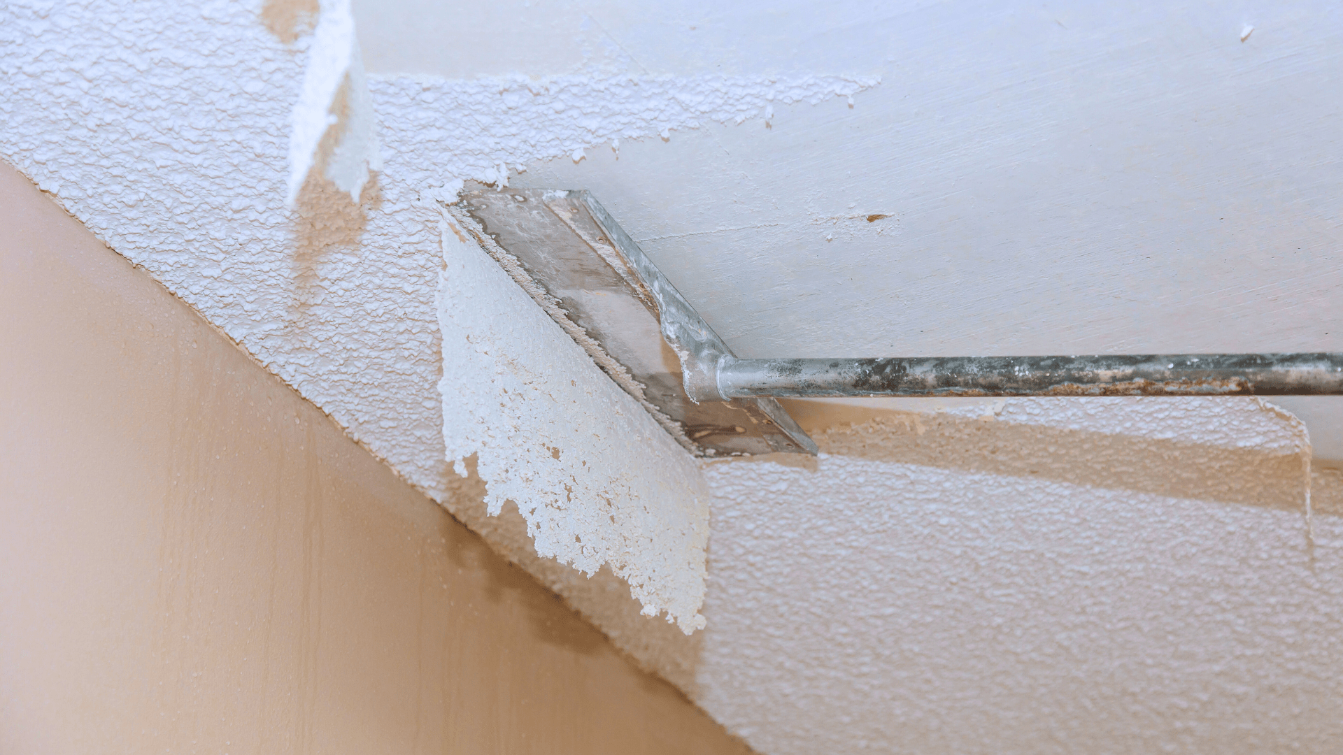 scraping off a popcorn ceiling