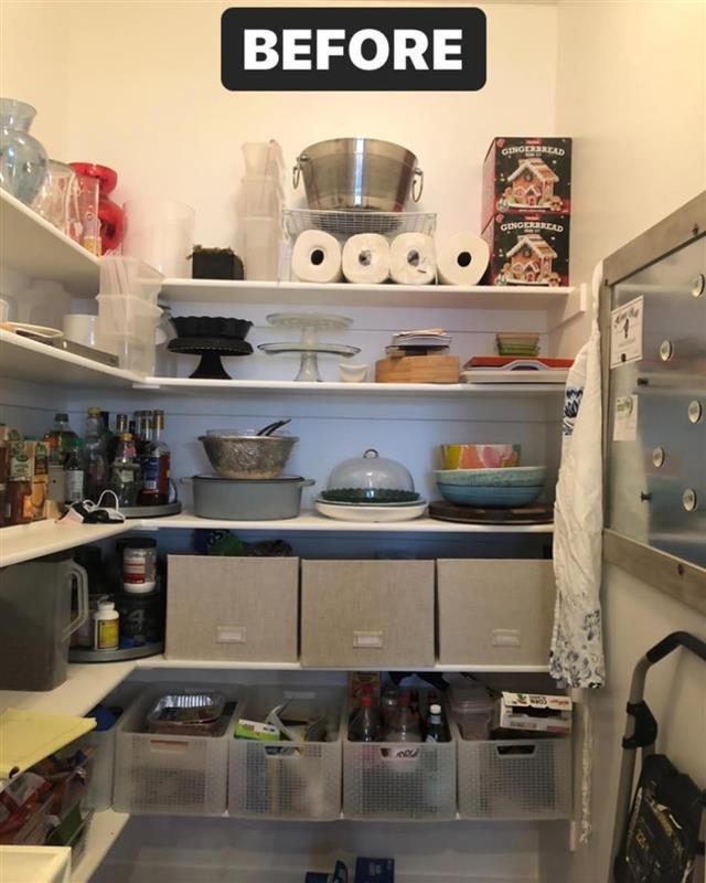 Pantry before organization. White shelves with various kitchen items, boxes, and food.