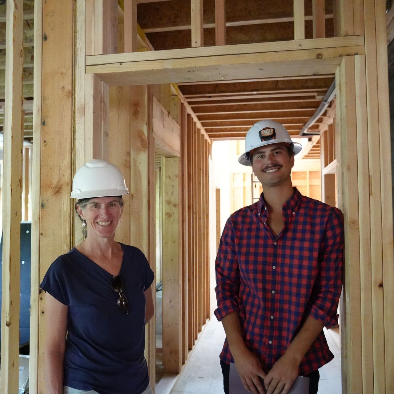 two Aspen CORE workers building in a home.