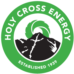 A logo for holy cross energy established 1939