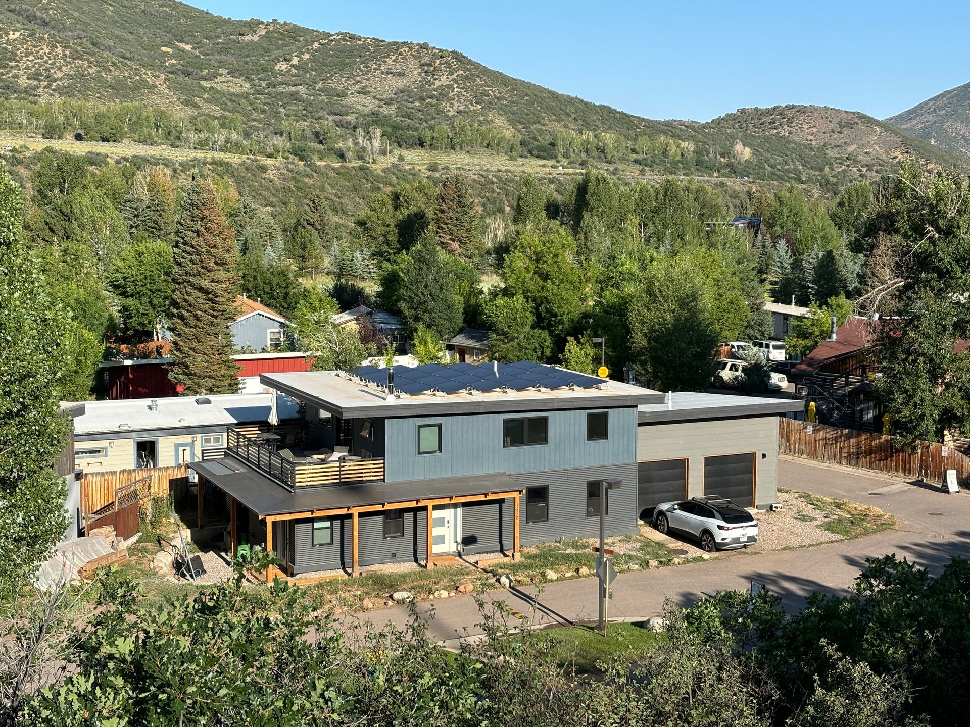 Modern home in a mountain community with Solar Panels on the roof.