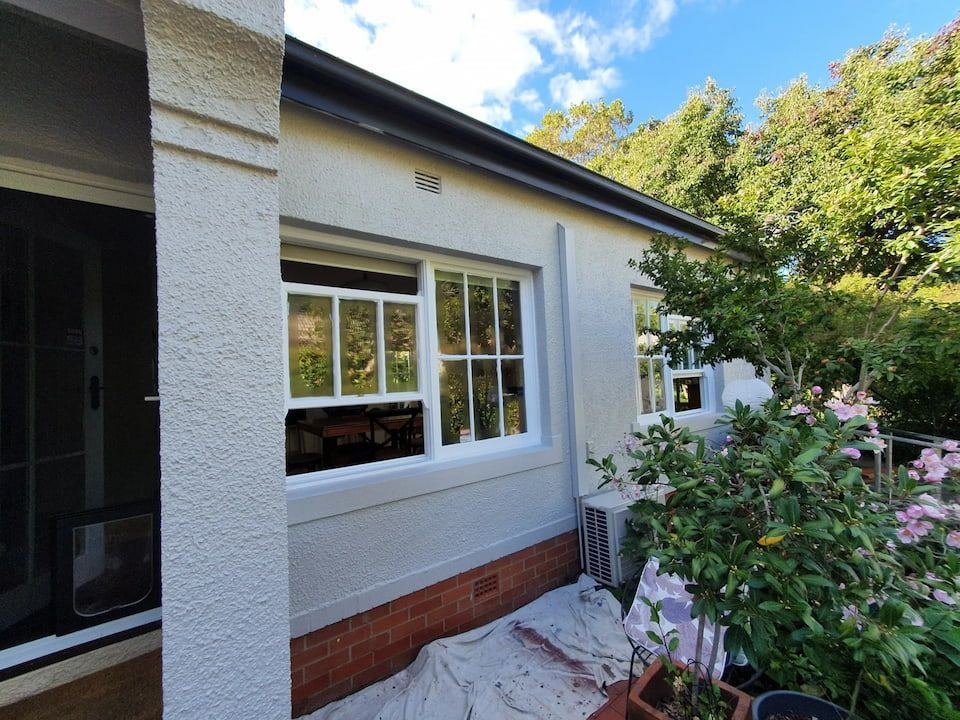 A White House With A Black Gutter And A White Window — Peter the Painter In Evatt, ACT