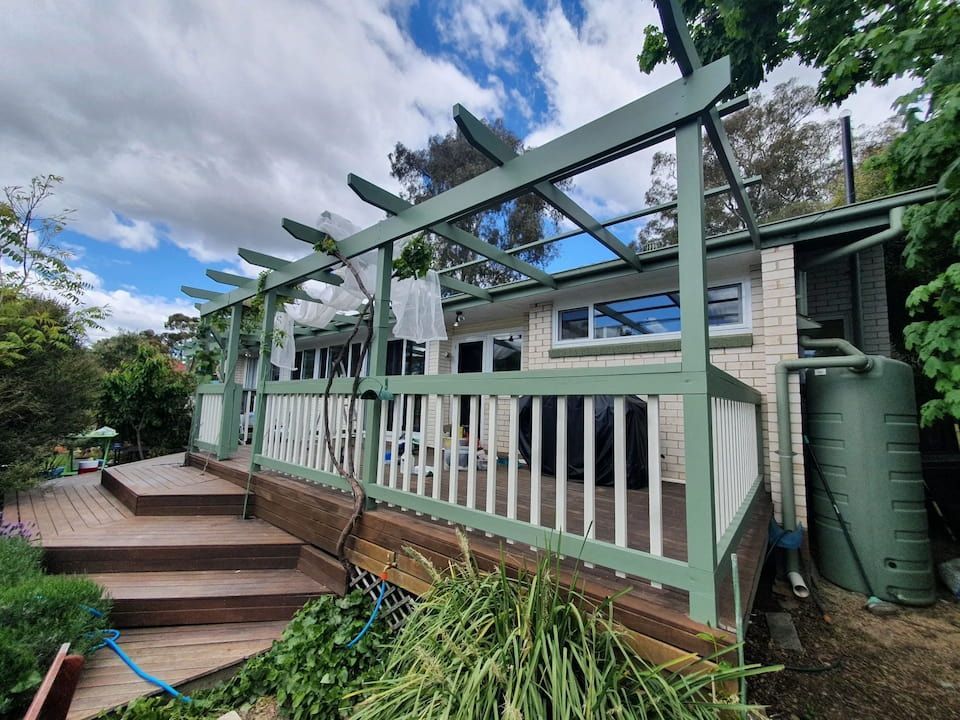 A House With A Green Deck And A White Railing — Peter the Painter In Gungahlin, ACT