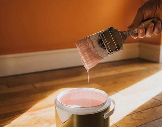 A Person Is Pouring Pink Paint Into A Can — Peter the Painter In Belconnen, ACT