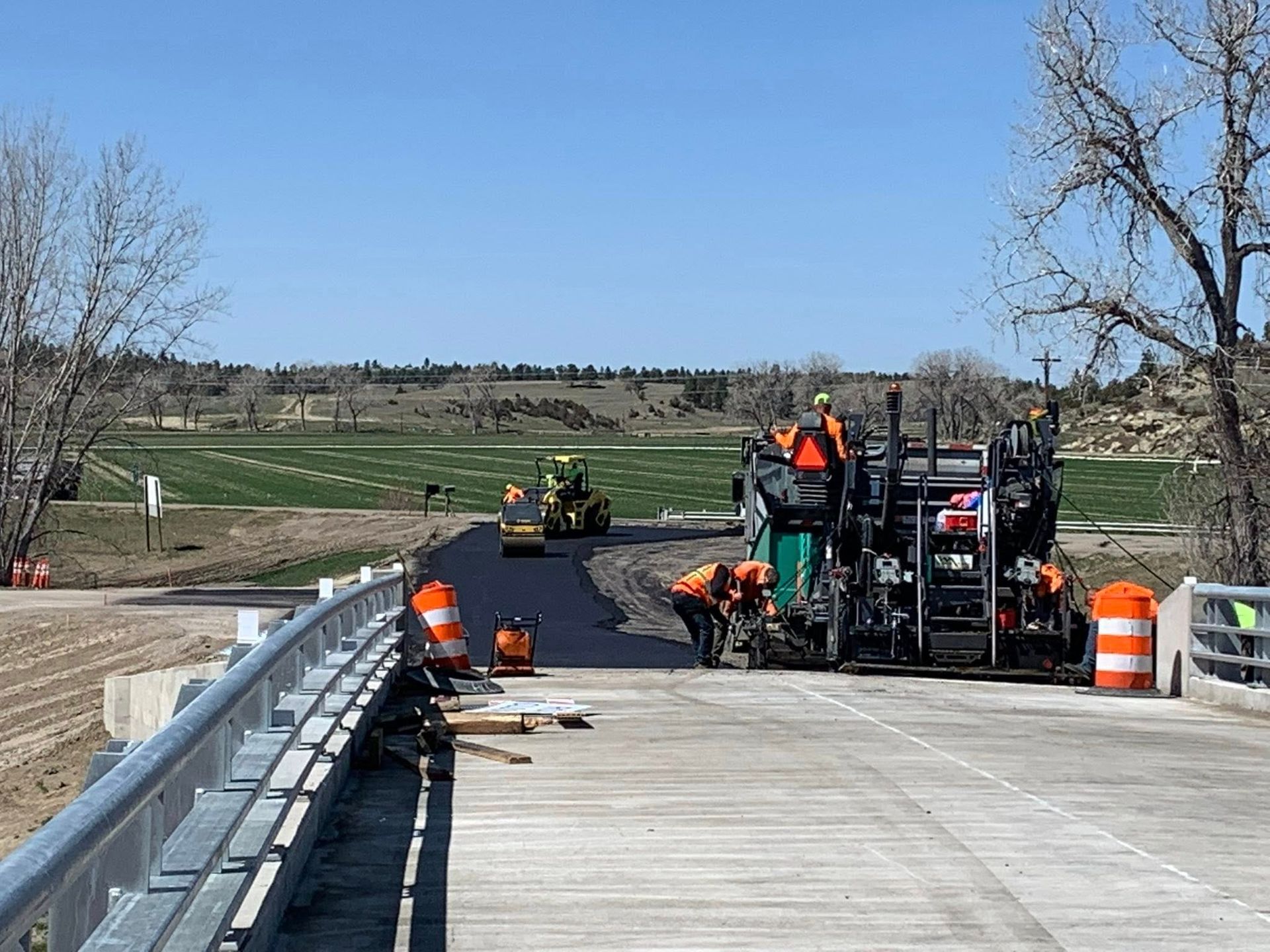 A group of construction workers are working on a bridge.