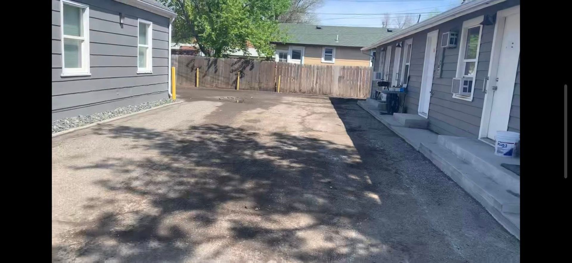 A house with a lot of dirt in front of it.