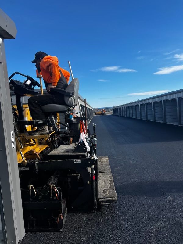 A man is driving a machine on a road