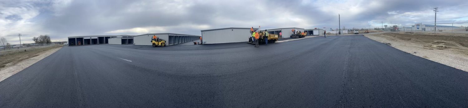 A panoramic view of a road with a lot of trucks on it.