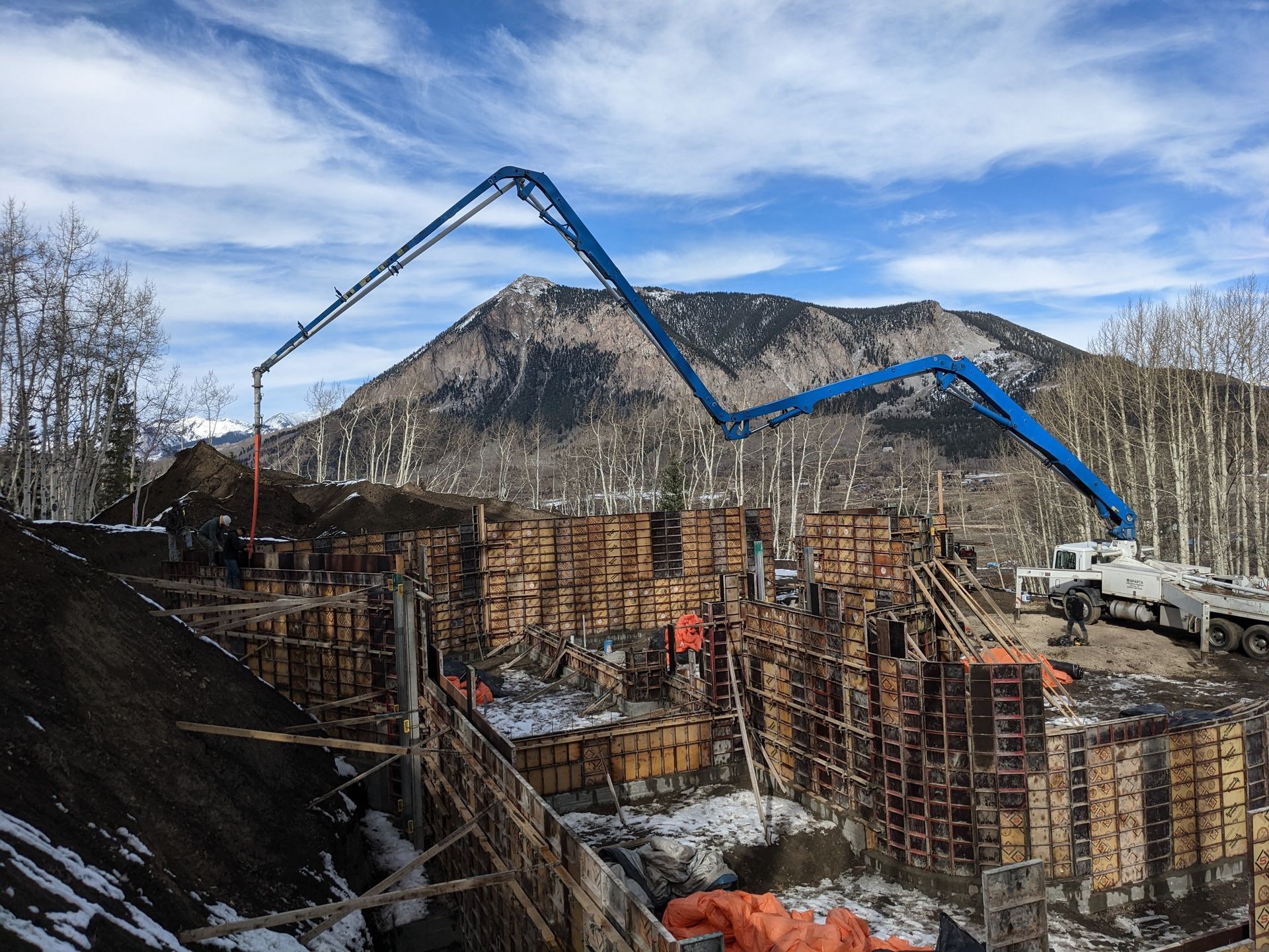 concrete boom truck pumping concrete