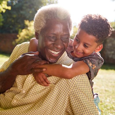 Senior Smiling With Grandchild — Atlanta, GA — Metro Dental