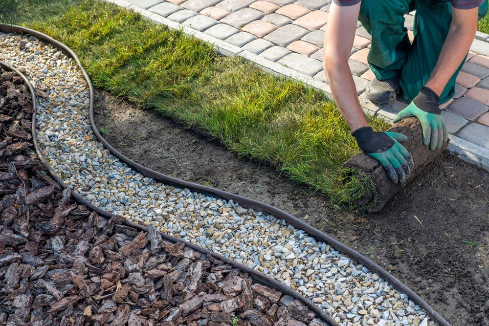Professional Worker Installing Sods