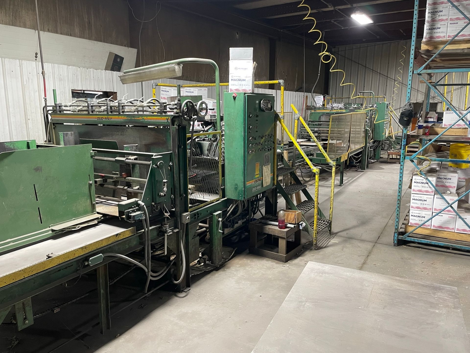 A warehouse filled with lots of boxes and machinery.