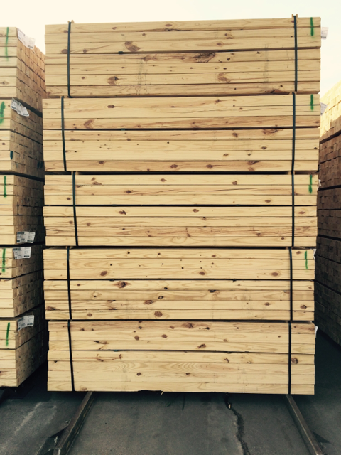 A stack of lumber with the letter t on it