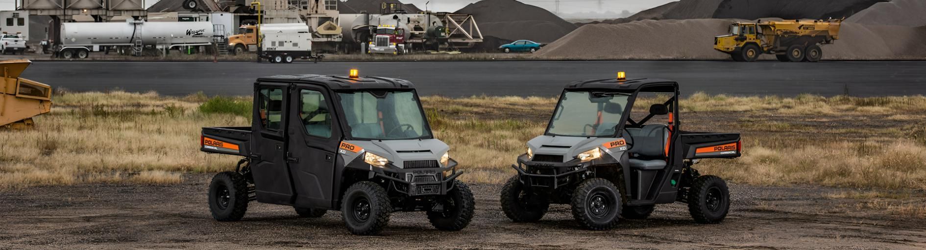 Two ATV Are Parked Next to Each Other in a Field — PowerMaster Batteries Moree in Moree, NSW