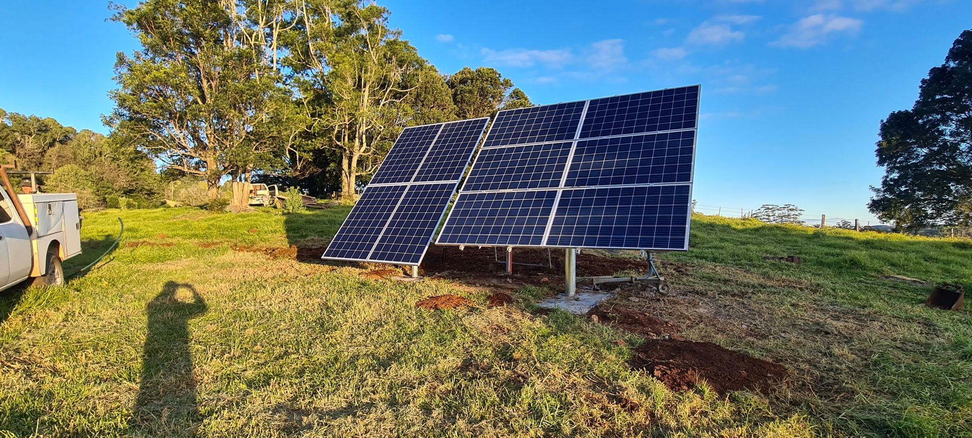 A Row of Solar Panels Sitting on Top of a Hill— Midcoast Irrigation & Horticultural Supplies In Wauchope, NSW