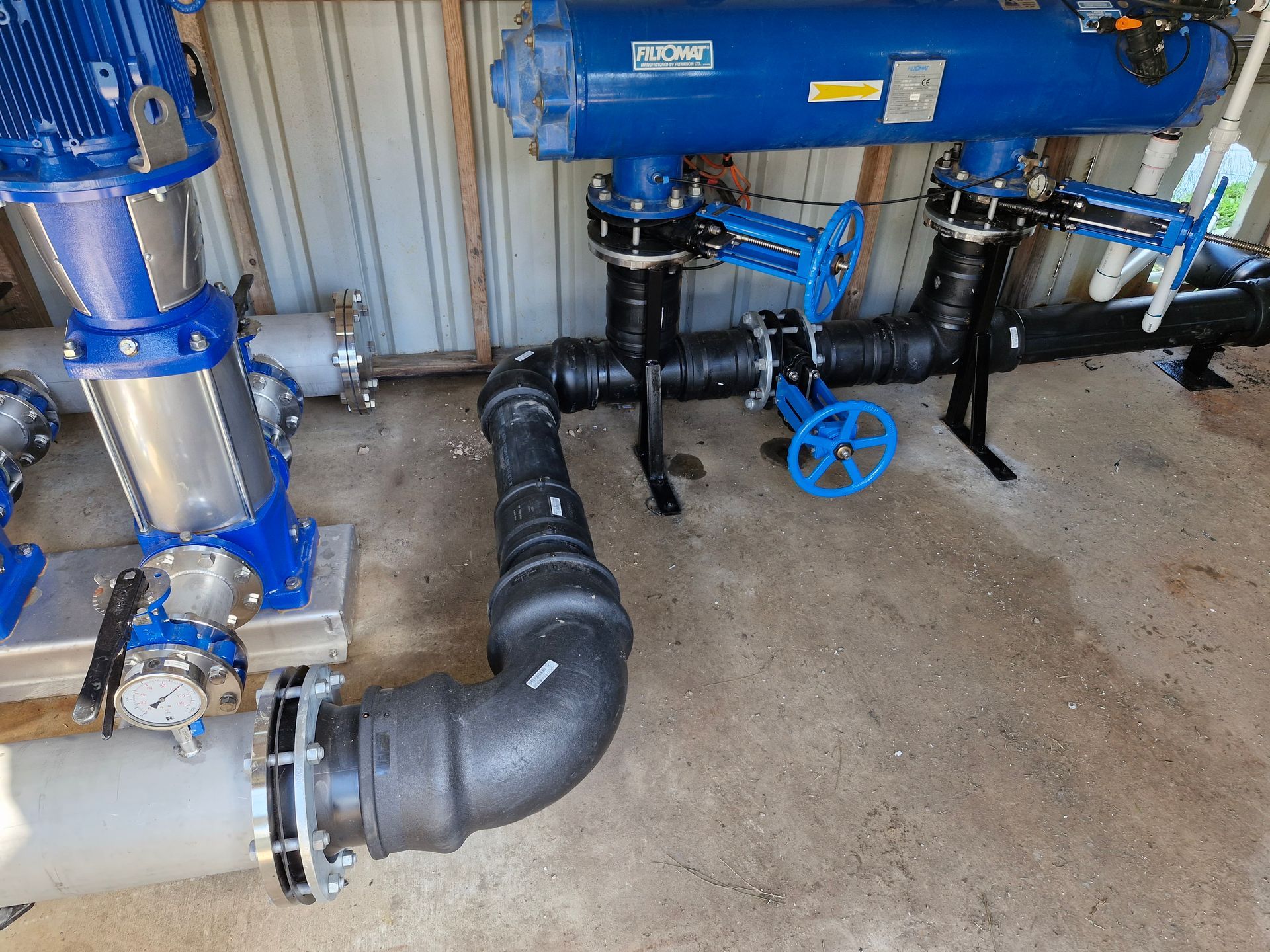 A bunch of pipes and valves in a room— Midcoast Irrigation & Horticultural Supplies In Wauchope, NSW