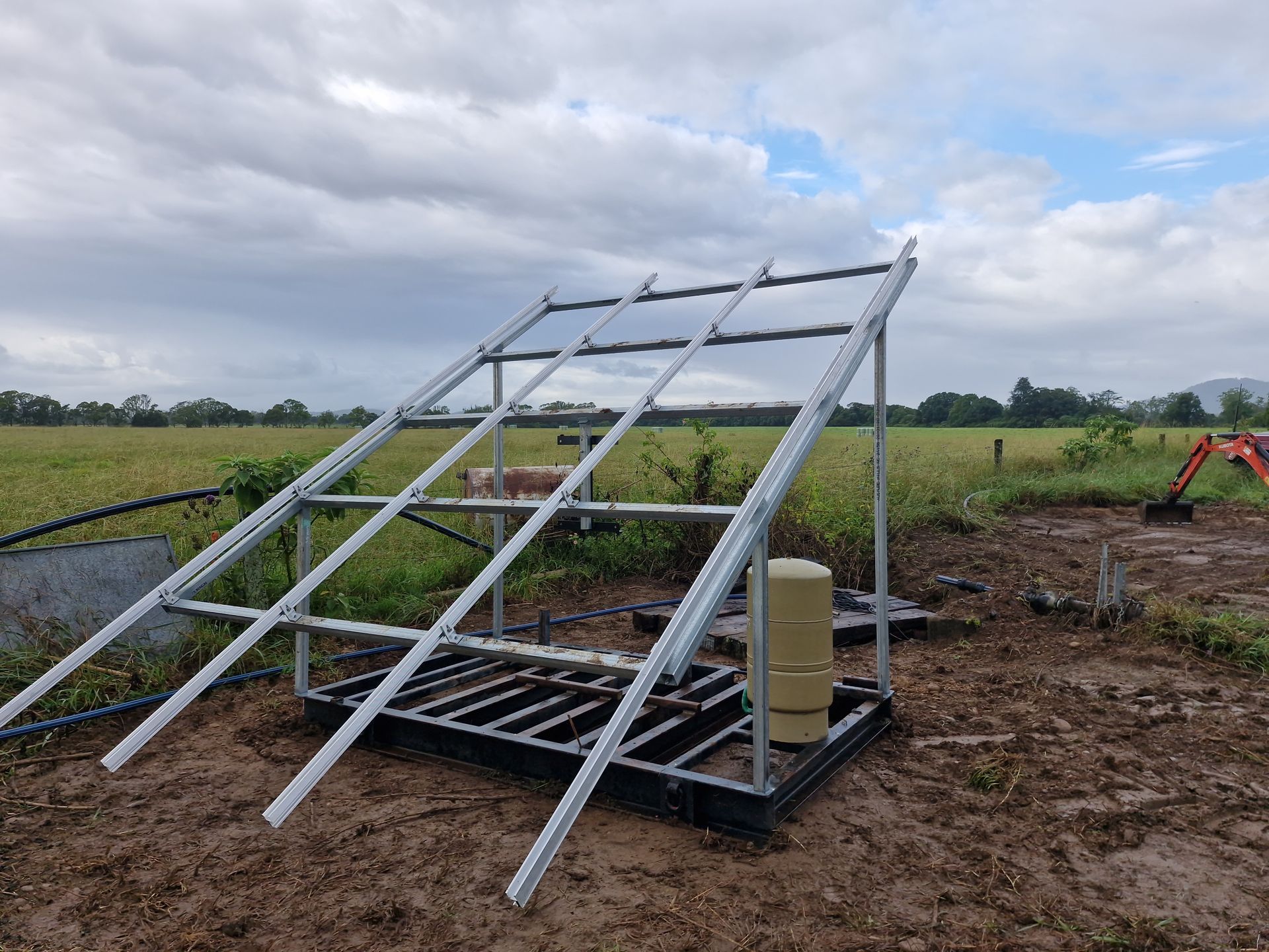 A metal structure is sitting in the middle of a field. — Midcoast Irrigation & Horticultural Supplies In Wauchope, NSW