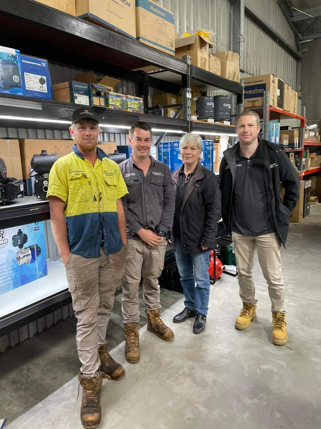 A Group Of People Are Standing In Front Of Shelves In A Store — Midcoast Irrigation & Horticultural Supplies In Wauchope, NSW