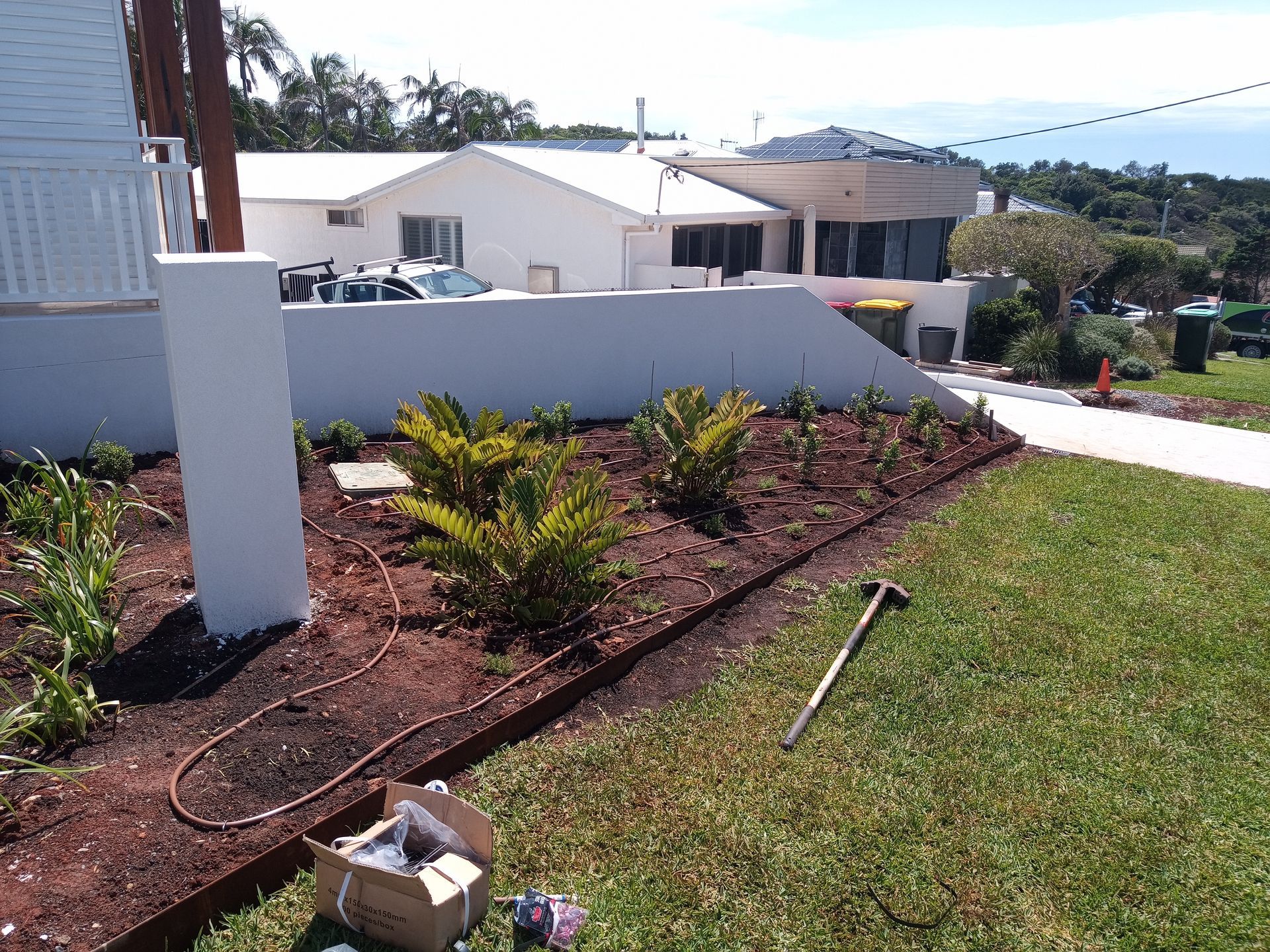 A residential irrigation system being installed on the front lawn— Midcoast Irrigation & Horticultural Supplies In Wauchope, NSW