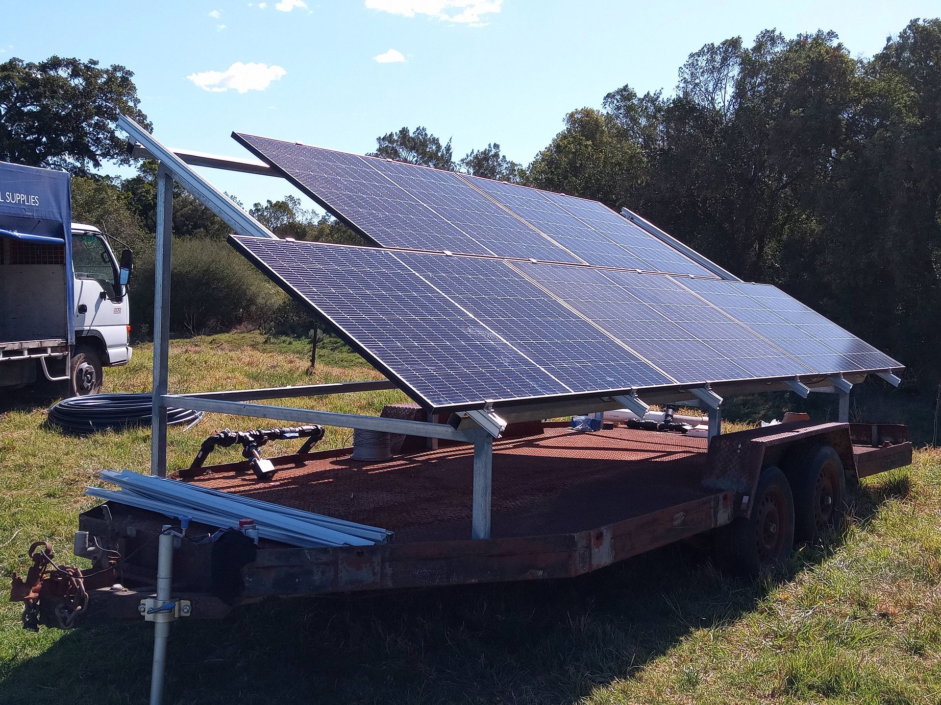 A trailer with a bunch of solar panels on it — Midcoast Irrigation & Horticultural Supplies In Wauchope, NSW