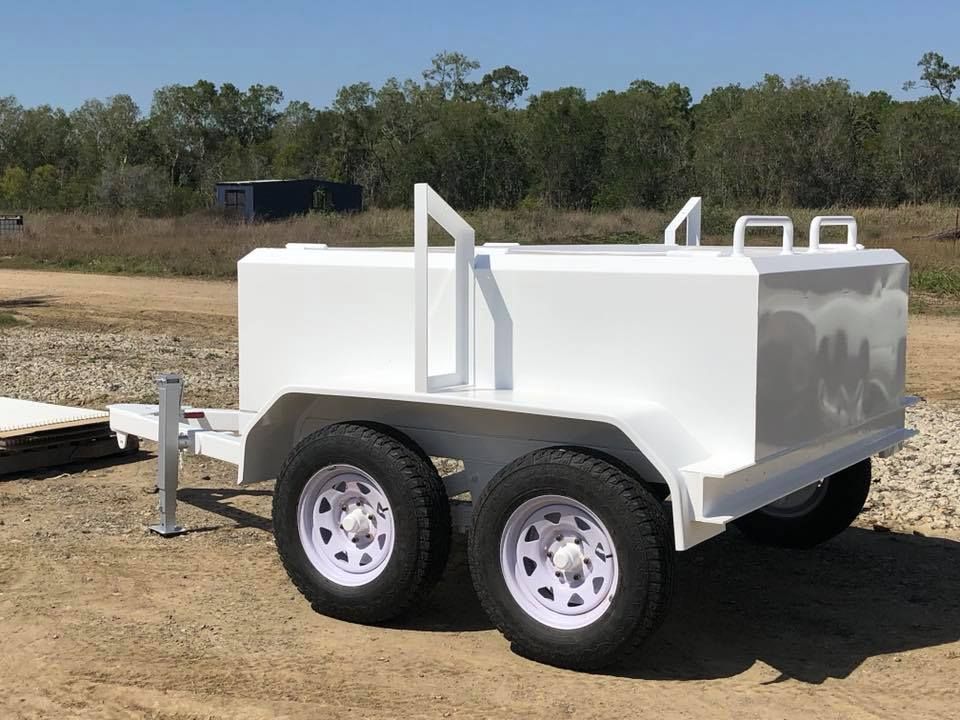 A White Trailer is Parked in a Dirt Field — All Blast and Paint in Sarina, QLD