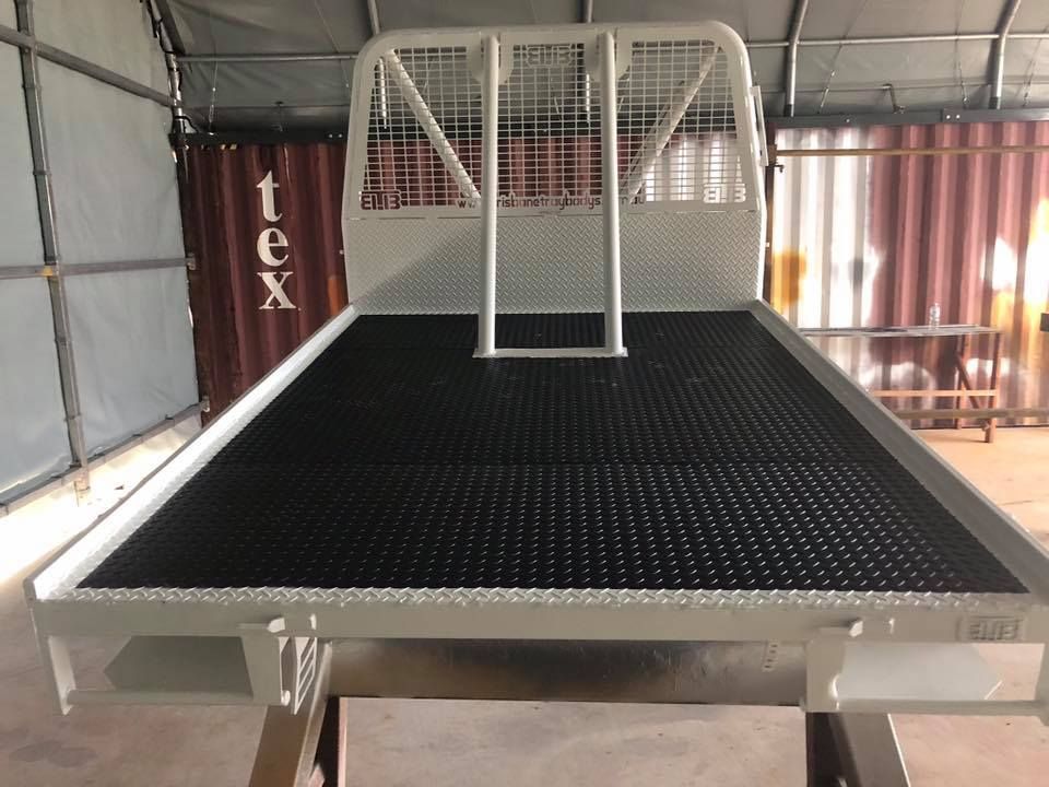 A Truck Bed With a Ladder Attached to It and the Word Tex on It — All Blast and Paint in Moranbah, QLD