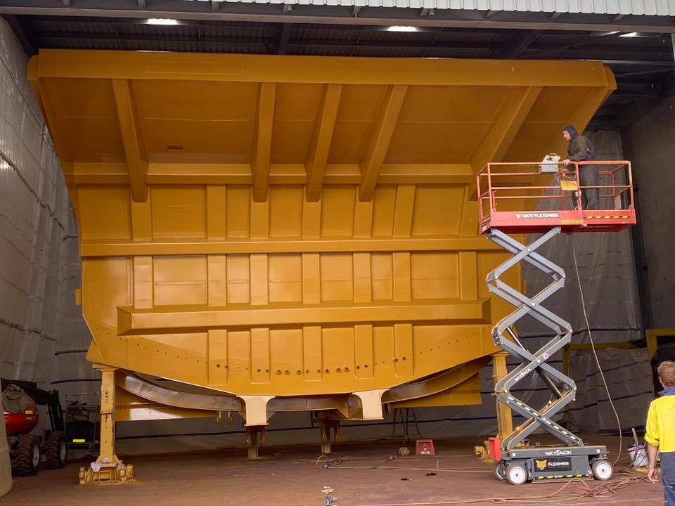 Man Spray Painting On Metal Work — All Blast and Paint in Bakers Creek, QLD
