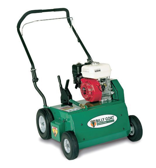 A green lawn mower with a honda engine