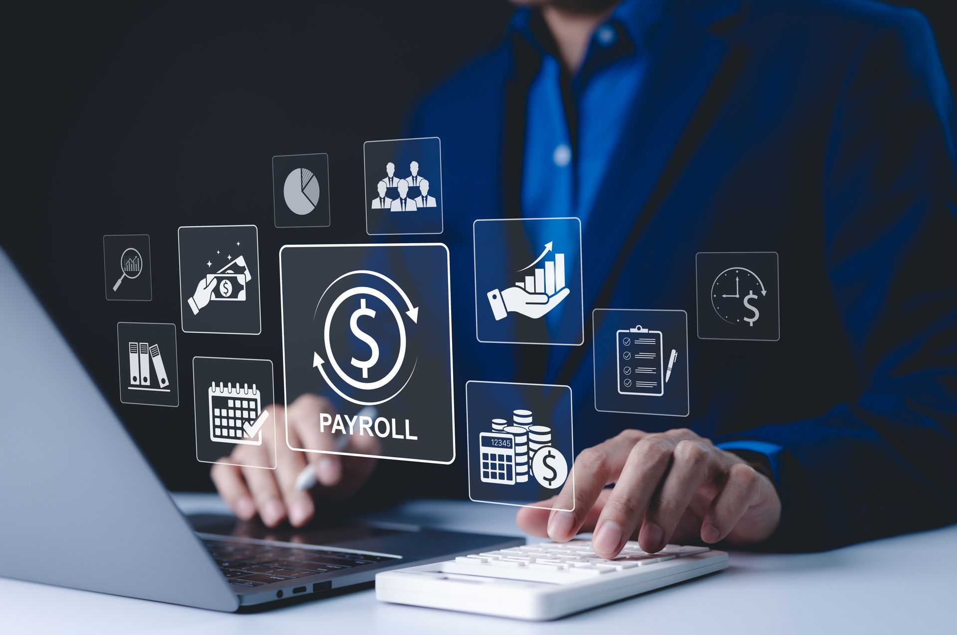 Person using laptop with payroll and financial icons floating above a desk