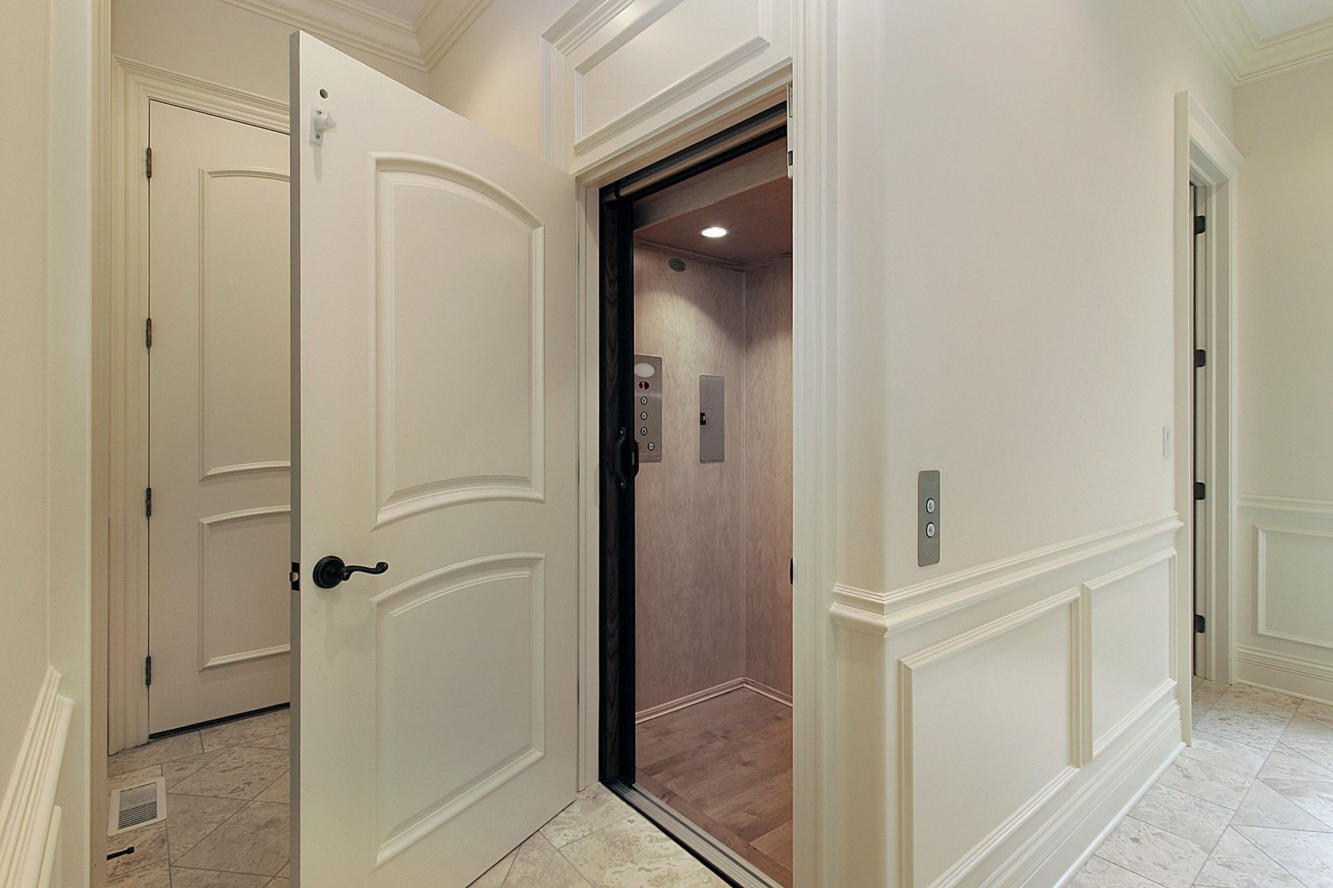 A Hallway With a Door Open to an Elevator