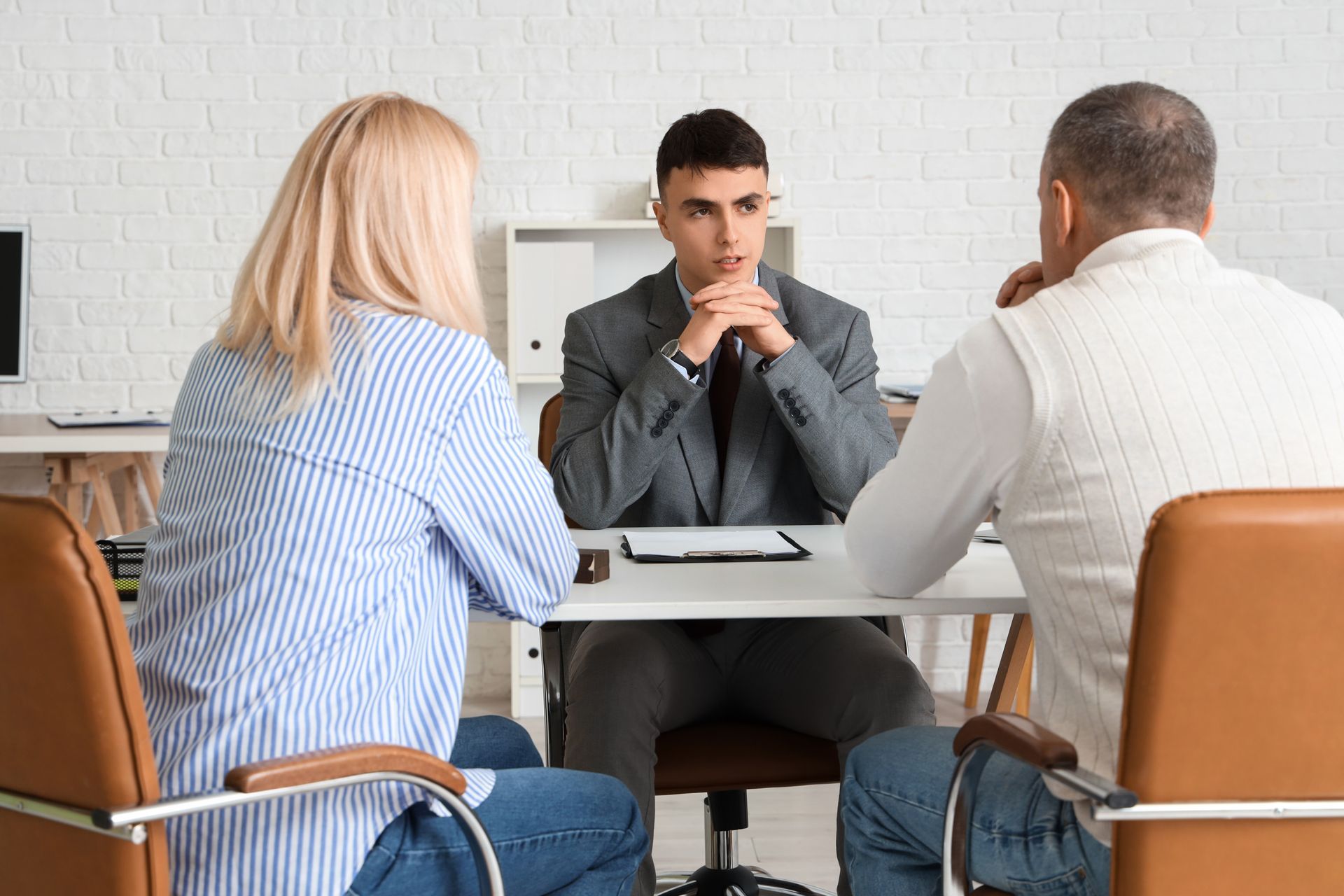 A couple consulting a child custody lawyer about custody and child support matters.