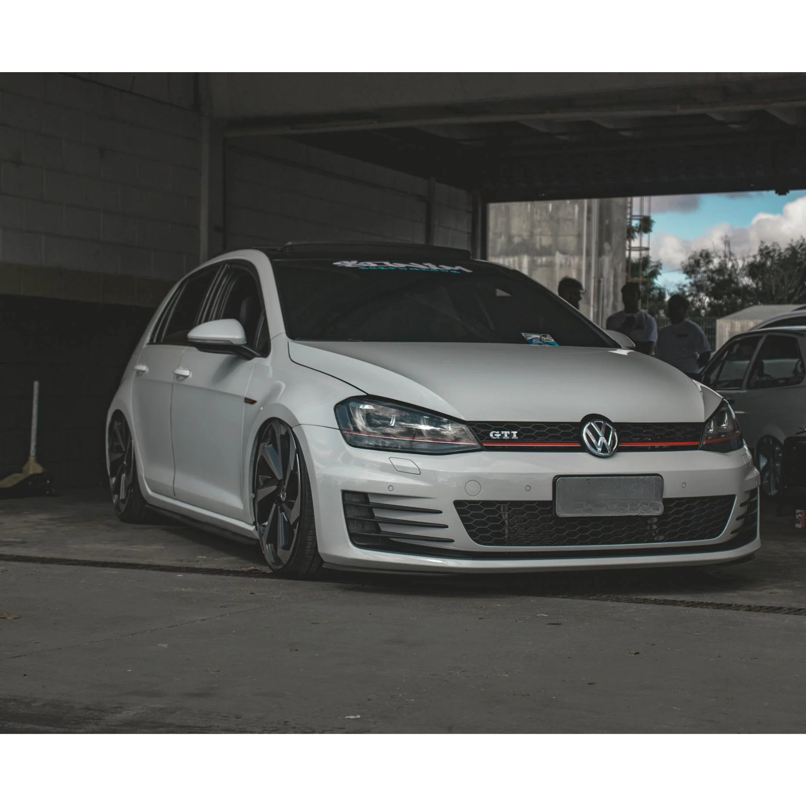 A Man is Working on the Engine of a Car With the Hood Open — Roadworthy's On The Run in Harristown, QLD