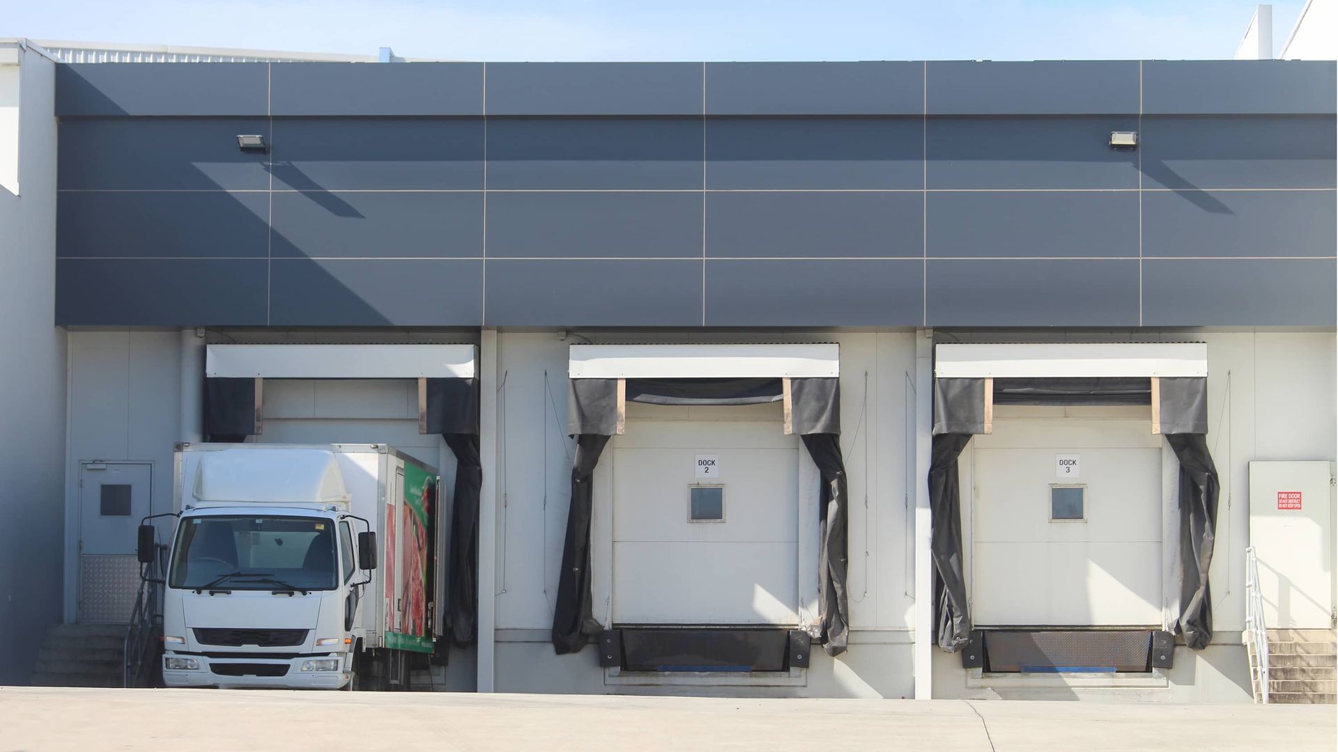 A White Truck is Parked in Front of a Warehouse — Roadworthy's On The Run in Harristown, QLD