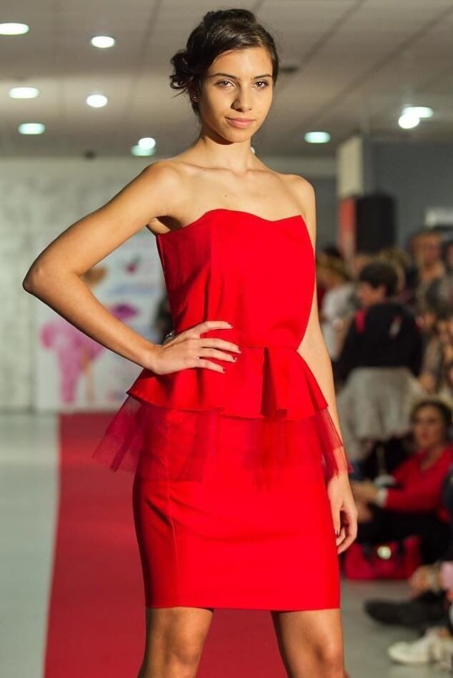 Model in elegant dress on the catwalk