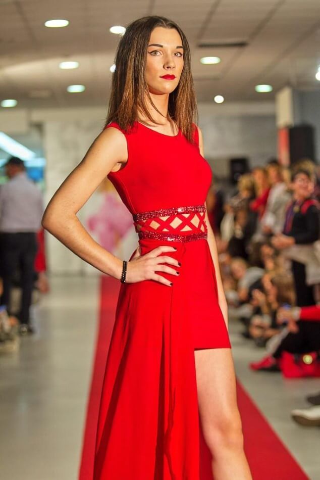 Model in elegant dress on the catwalk