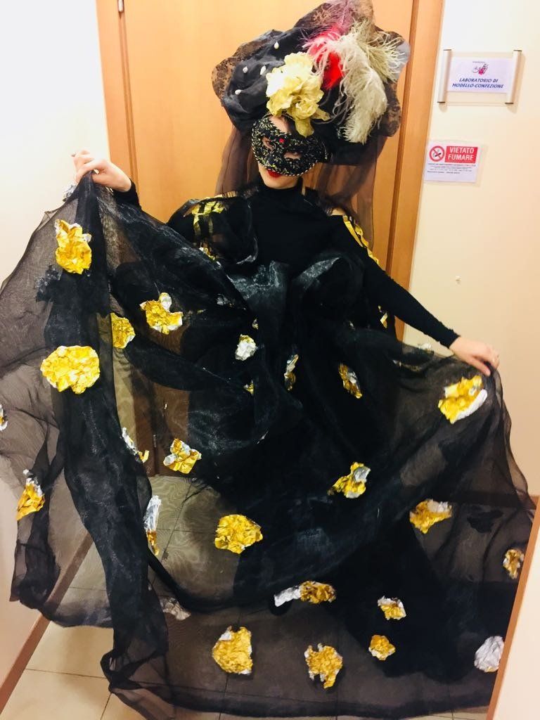 Model in black and yellow dress