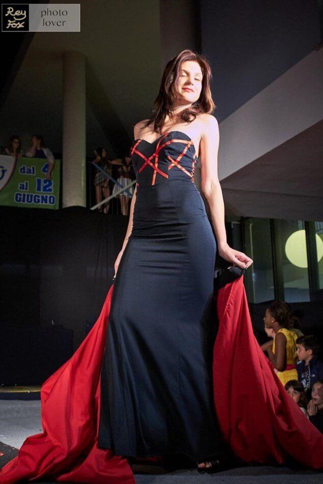 Model in elegant dress on the catwalk